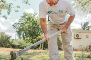 Keeping lawns neat in front of burned homes - a year on at kibbutz where Hamas killed 101